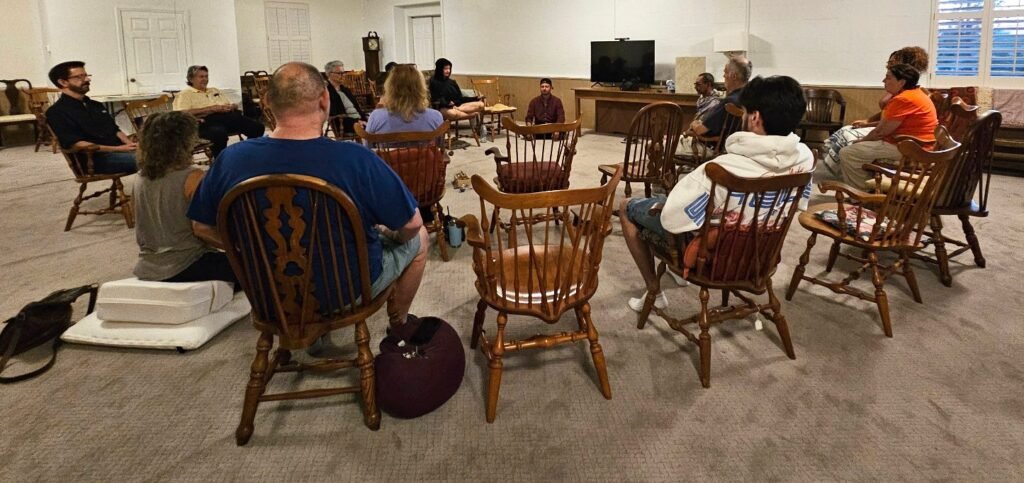 A group of people practicing meditation in Lake Worth, Florida.